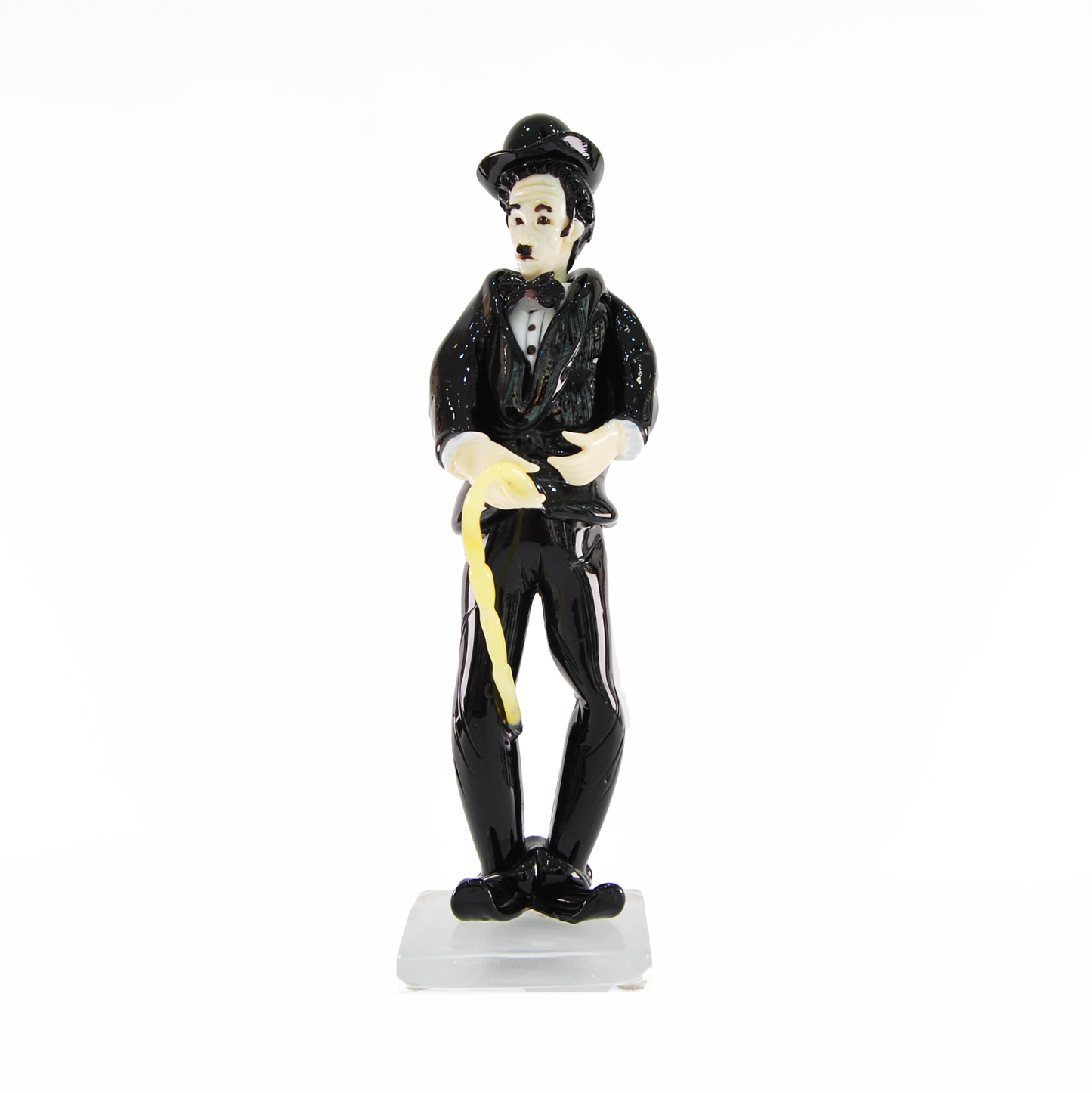 CHARLIE CHAPLIN IN BLACK SUIT WITH CANE