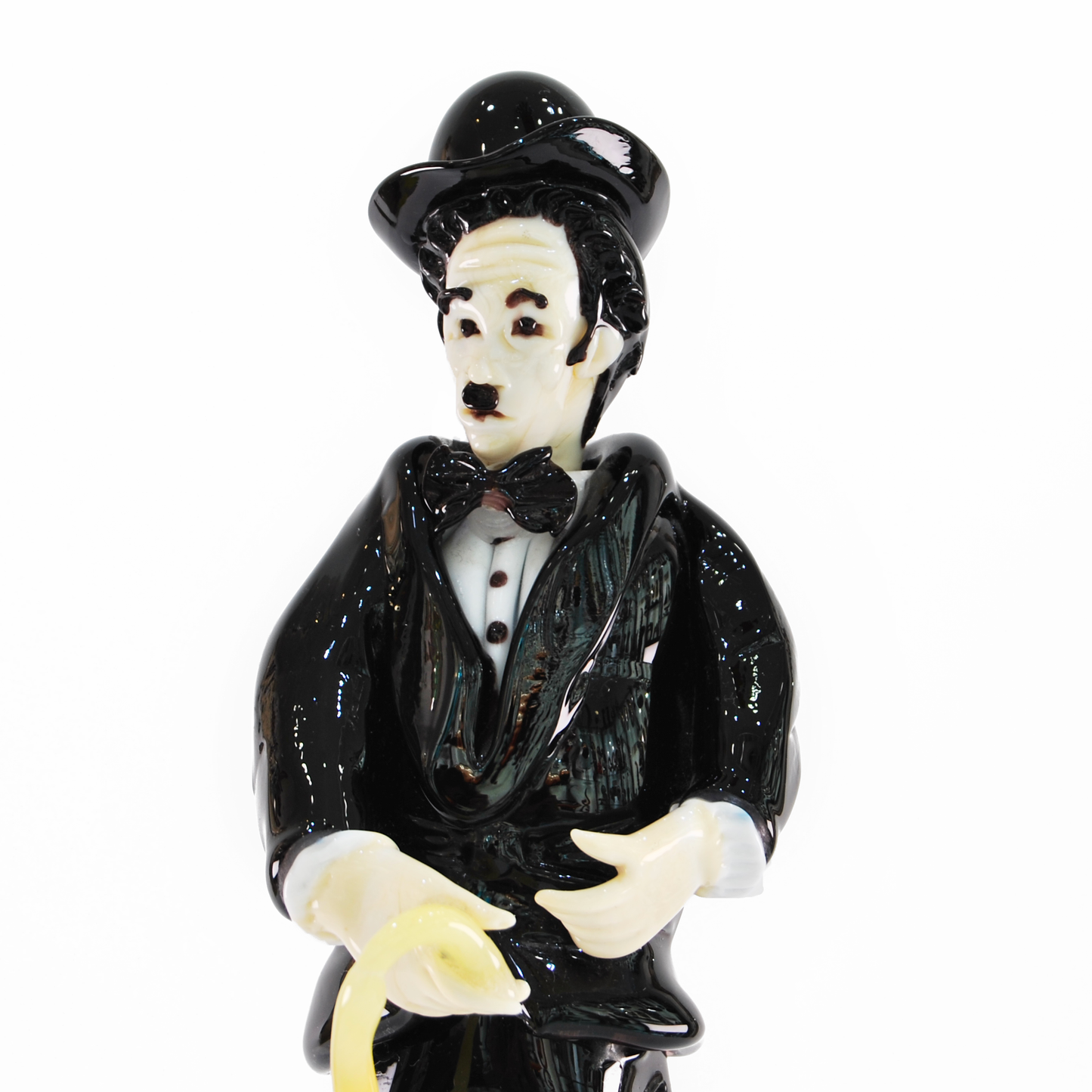 CHARLIE CHAPLIN IN BLACK SUIT WITH CANE